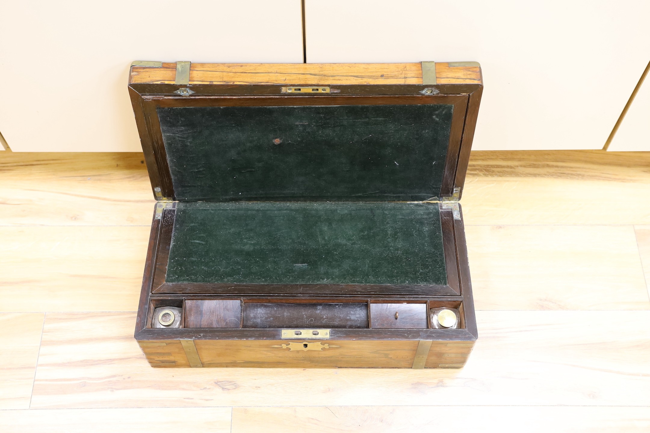 A Victorian rosewood and brass bound writing slope, 50.5 cm wide